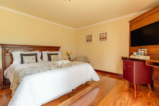 غرفة ديلوكس ثلاثية بسرير كوين وسرير فردي بشرفة، Pousada Villa D'biagy 3/6