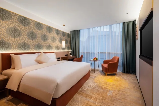 غرفة بريميوم بسرير كينج وسرير كوين، Guangzhou Wogo Yuanbao Hotel (Zhujiang New Town) 1/3