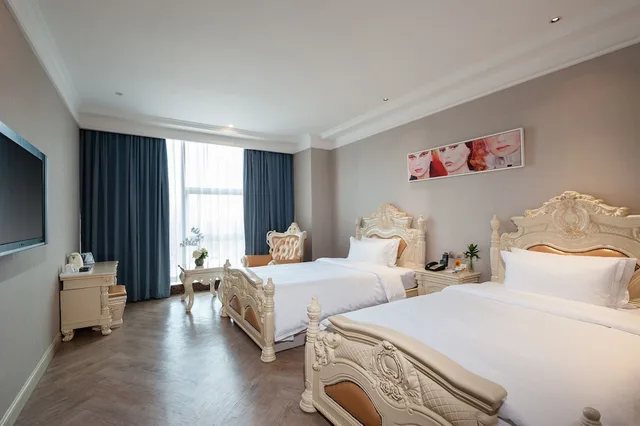 غرفة بسريرين منفصلين بإطلالة على الحديقة، Nan Yang Royal Hotel 2/4
