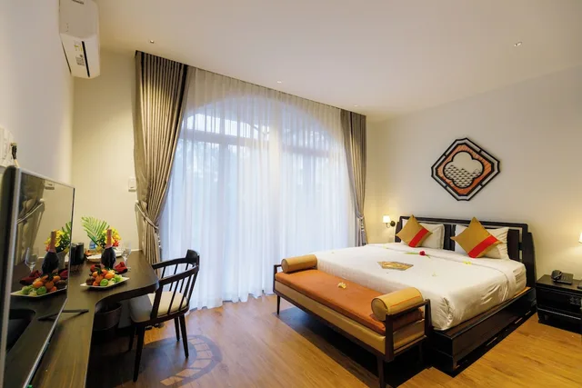 غرفة عائلية بسرير كوين وسريرين منفصلين بإطلالة على الحديقة، Le Aqua Resort & Spa Phan Thiet 5/7