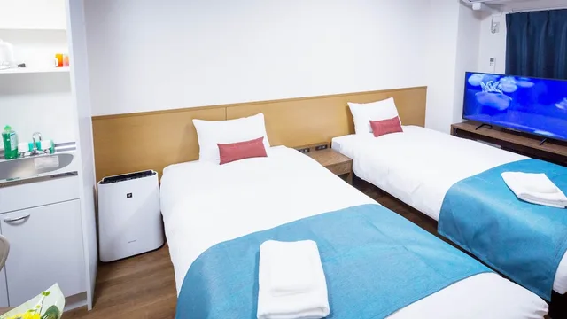 غرفة قياسية بسريرين منفصلين، Kariyushi Condominium Resort Naha Ryujin Hotel Ukishima 1/4