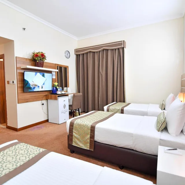 غرفة ثلاثية بسرير فردي، NEJOUM AL EMARATE HOTEL 3/8