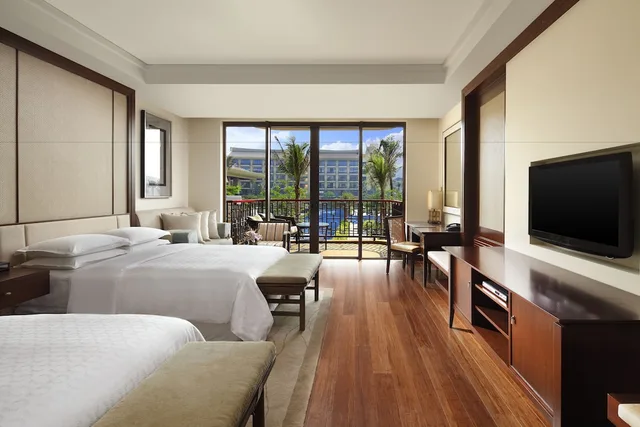 غرفة ديلوكس بسرير كينج بشرفة، Sheraton Shenzhou Peninsula Resort Wanning Hainan 4/5