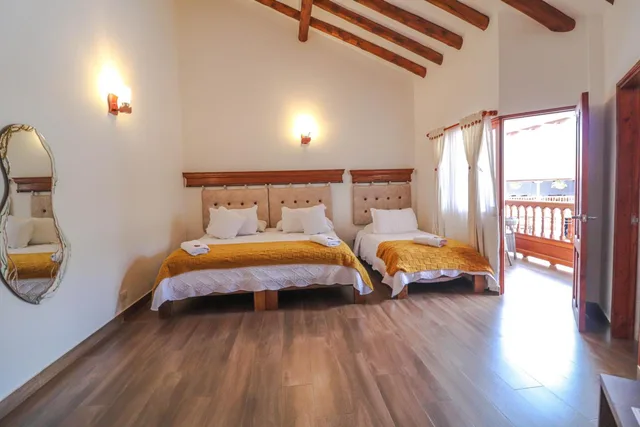 غرفة ديلوكس ثلاثية بسرير كوين وسرير فردي، Hotel Las Palmas Villa De Leyva 4/10