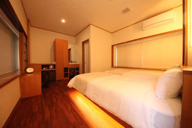 غرفة بسريرين منفصلين بإطلالة على الحديقة، Ichinomatsu Japanese Modern Hotel 1/4