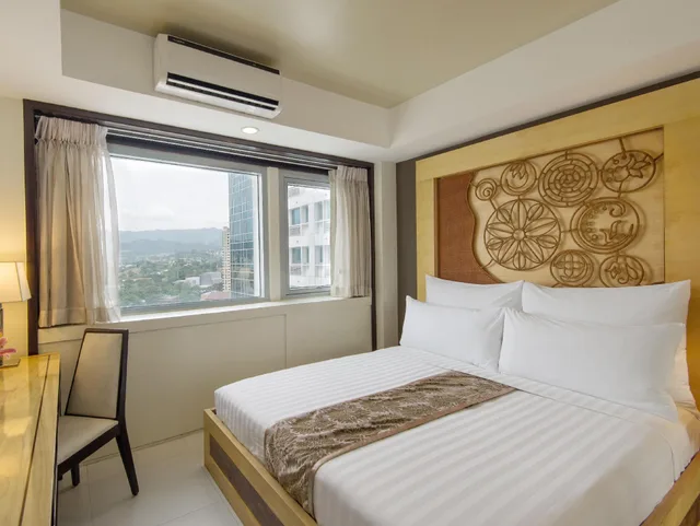 جناح جونيور بسرير كينج مع أريكة، Quest Hotel Conference Center 1/1