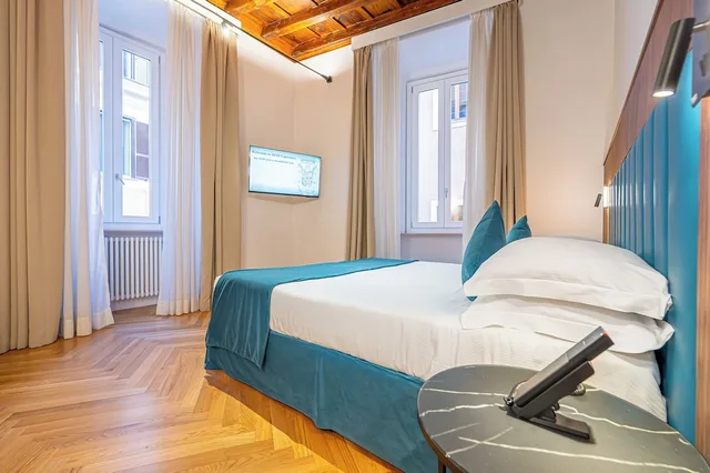 غرفة ديلوكس ثلاثية بسرير كينج وسرير فردي في الملحق، Albergo Abruzzi 5/9