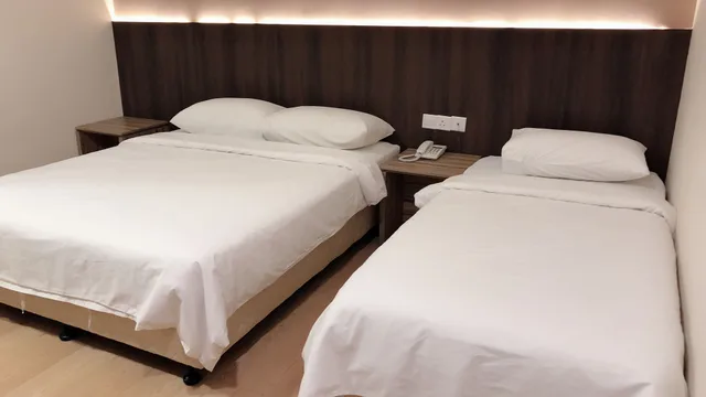 غرفة سوبيريور ثلاثية بسرير كوين وسرير فردي، Tumike Hotel 2/3