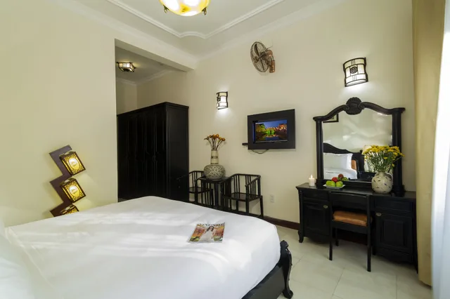 غرفة غراند بسرير كينج بإطلالة على المسبح بشرفة، Nesta Hoi An Resort and Spa 1/9
