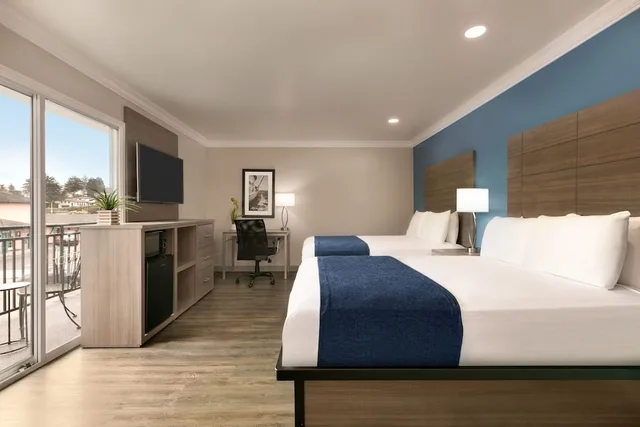 غرفة سيغنتشر بسريرين كوين، Torch Lite Inn 1/5