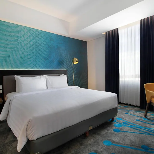 غرفة ديلوكس بسرير كينج وسرير كوين للمدخنين، Swiss-Belinn Airport Surabaya 3/10