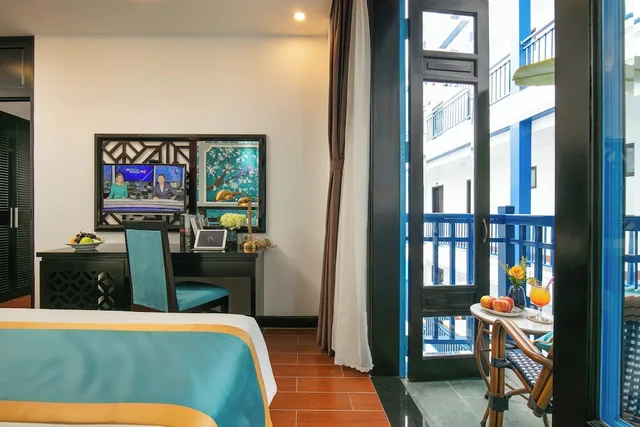 جناح متصل عائلي بسريرين مزدوجين بإطلالة على المسبح بشرفة، Silk River Hoi An Hotel & Spa 2/2