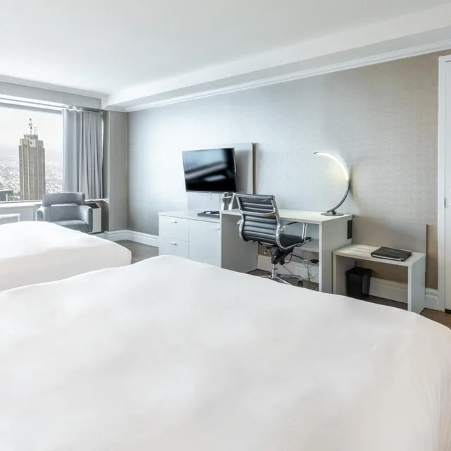 غرفة ديلوكس بسريرين مزدوجين وسرير كينج، Le Concorde Hotel 4/6
