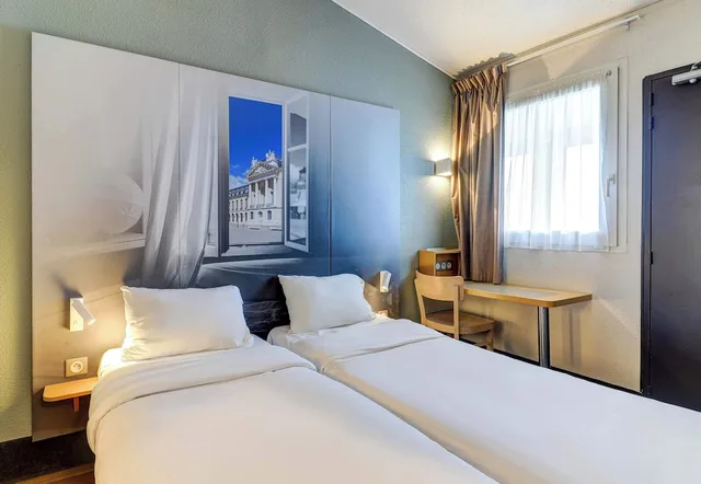 غرفة بسريرين منفصلين، B&B Hotel Dijon Marsannay 1/6