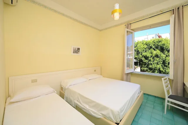غرفة اقتصادية ثلاثية بسرير مزدوج وسرير فردي، Hotel Villa Diana 3/6