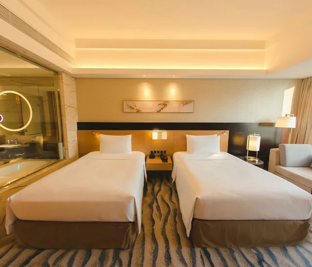 غرفة ديلوكس بسريرين منفصلين بإطلالة على البحر، Hilton Yantai Golden Coast 1/5