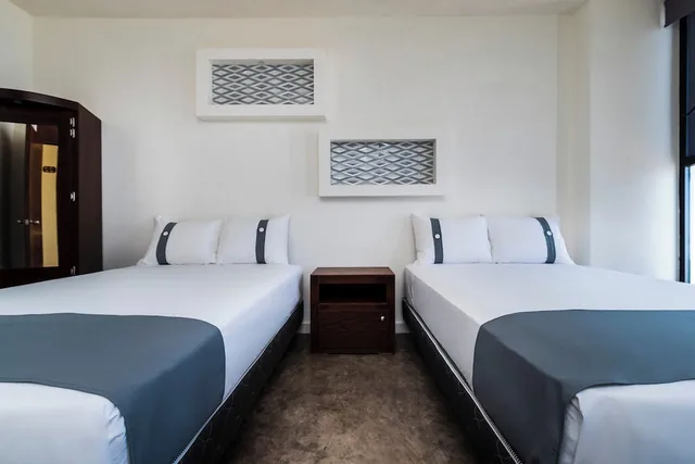غرفة ديلوكس بسريرين مزدوجين، Capital O Hotel Joyma Suites, San Luis 3/7