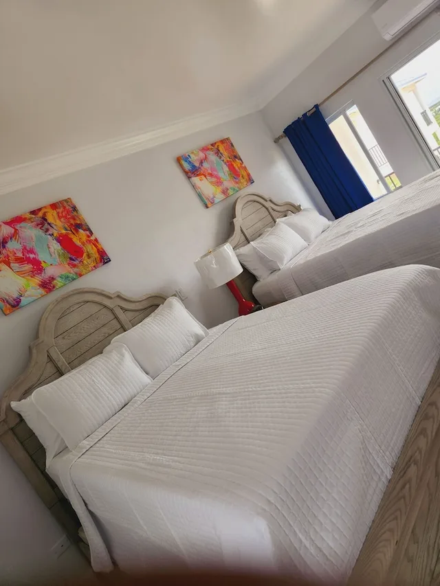 غرفة ديلوكس بسريرين كوين بإطلالة على الحديقة، Harbor Breeze Villas 1/5