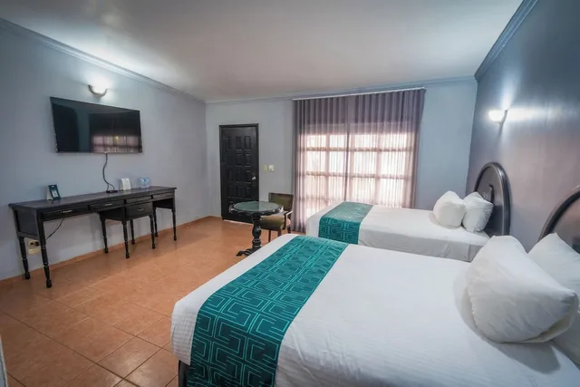 غرفة قياسية بسريرين مزدوجين بإطلالة على الحديقة، InHouse Select Hacienda Tres Rios 1/10