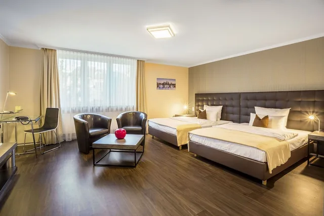 غرفة عائلية بسريرين كوين، Villa Westend Hotel An Der Messe GMBH 1/3