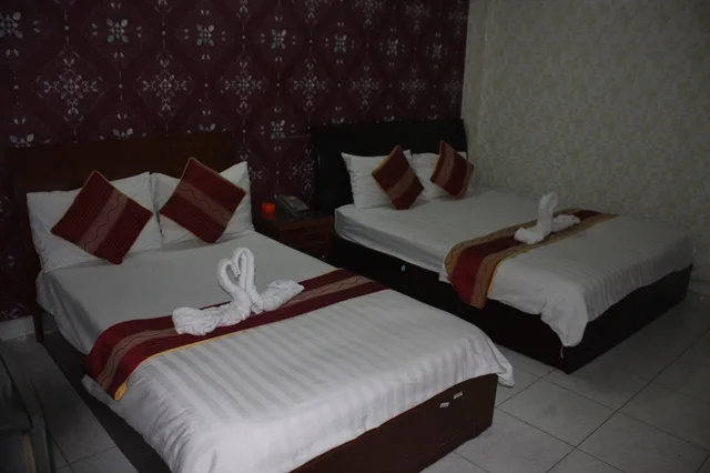 غرفة ديلوكس ثلاثية بسرير كوين وسرير فردي بإطلالة على المدينة، Yoko Airport Saigon Hotel 2/10