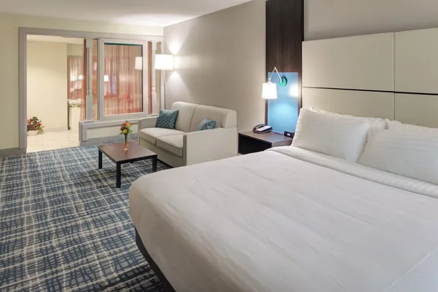 Suite, King Bed, Living and Dining Areas, Holliday Inn Belcamp Aberdeen Area Ex Wingate By Wyndham Aberdeen Edgewood 1/10