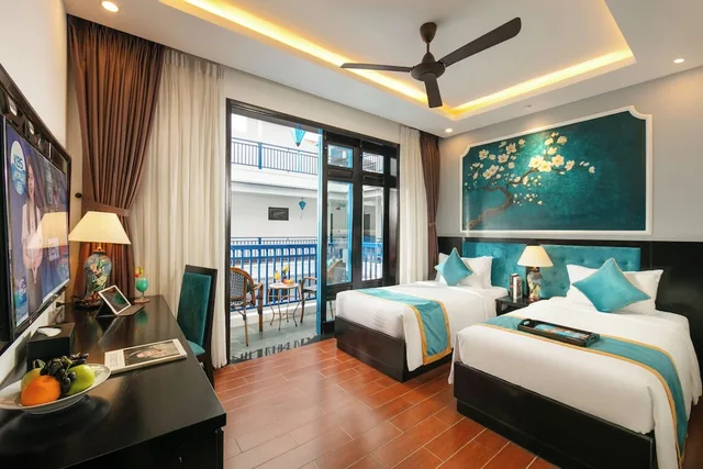 جناح متصل عائلي بسريرين مزدوجين بإطلالة على المسبح بشرفة، Silk River Hoi An Hotel & Spa 1/2