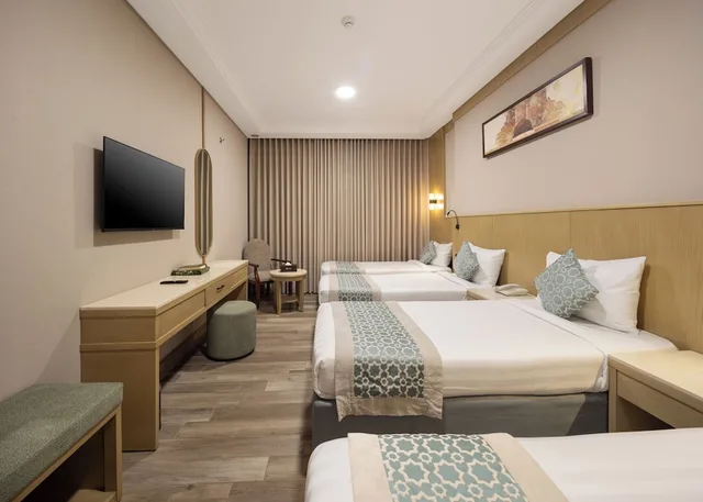 غرفة رباعية بأربعة أسرّة، فندق عفراء(Afraa Hotel) 4/8