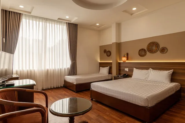 غرفة ديلوكس ثلاثية بسرير كوين وسرير فردي، Lantern Hotel 3/8