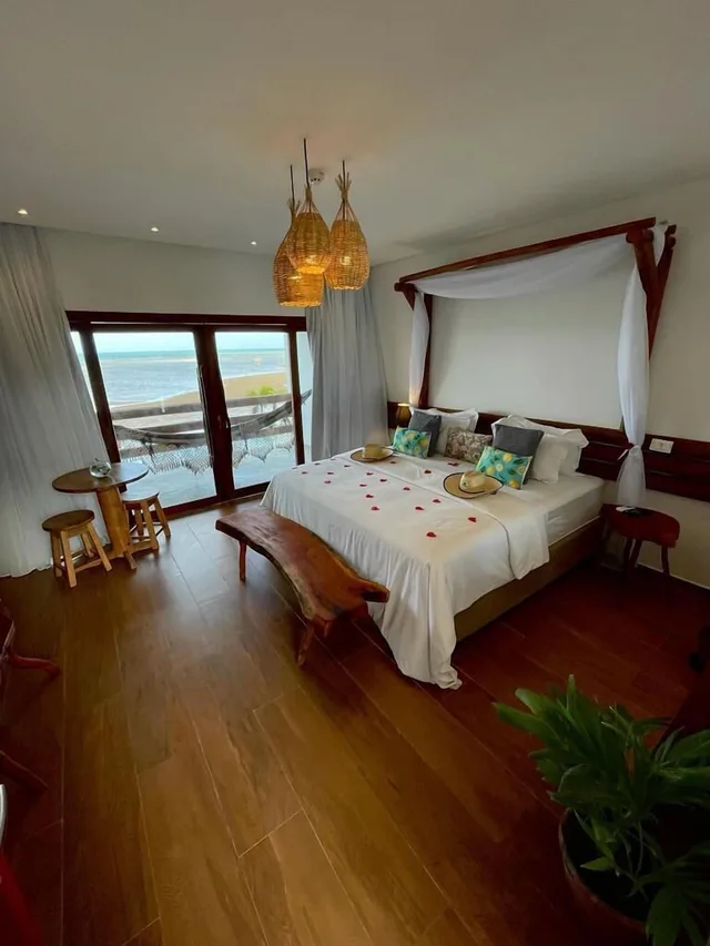 غرفة ديلوكس بسرير كينج بإطلالة على البحر بشرفة، Villa Pantai Boutique Hotel Maragogi 1/1