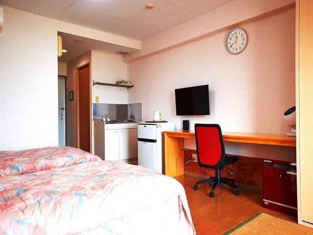 غرفة يابانية غربية بسريرين منفصلين وفرشتي فوتون بإطلالة على البحر في الملحق، Condominium Hotel Shimanchu Club 5/9