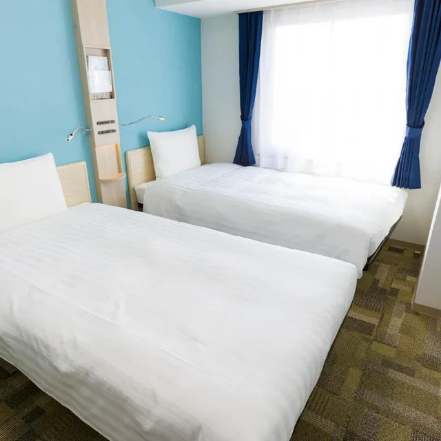 غرفة بسريرين منفصلين للمدخنين، Toyoko Inn Satsuma Sendai Eki Higashi Guchi 9/10