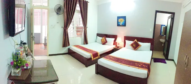 غرفة عائلية رباعية بسريرين مزدوجين بإطلالة على الحديقة للمدخنين، QUAN QUAN HOTEL 4/6