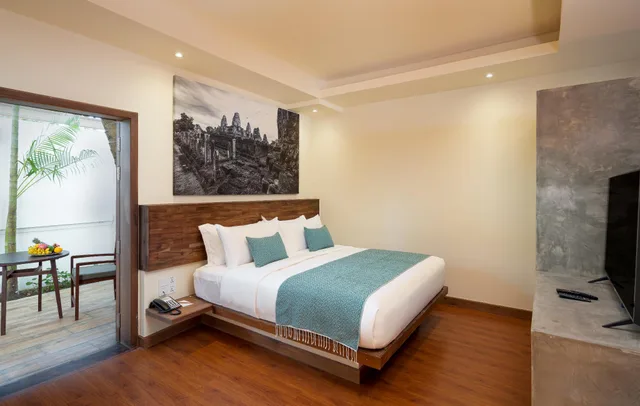غرفة عائلية بسرير كينج وسريرين منفصلين بإطلالة على الحديقة، Amatak Boutique Hotel 1/2