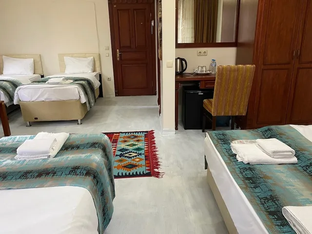غرفة عائلية بسرير كوين وسريرين فرديين، Atam Suites Apart 8/10