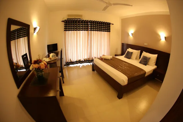 غرفة ديلوكس ثلاثية بسرير كوين، Hotel Shanelo 1/1