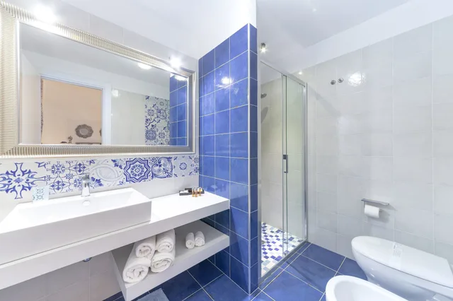 غرفة بريميوم رباعية بسرير كوين وسريرين منفصلين، Quattrocuori Room & Relax 2/3