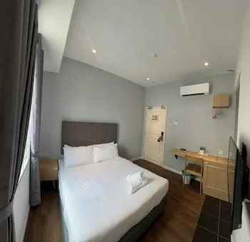 غرفة ديلوكس بسرير كينج وسرير كوين، Havona Boutique Hotel at Mount Austin 1/1