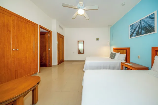 2 Bedrooms, Riviera, 1 King and 2 Double Beds, Garden View، Riviera Maya Suites 2/10