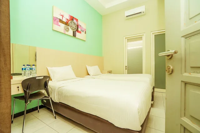 غرفة قياسية بسريرين منفصلين، Ardhya Guest House 5/9