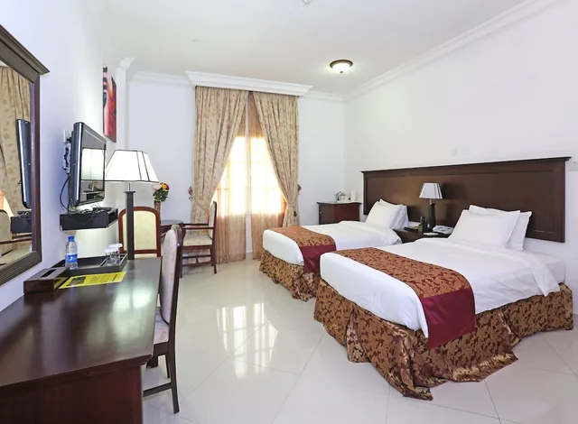 غرفة ديلوكس بسرير كينج، Al Maha International Hotel 1/5