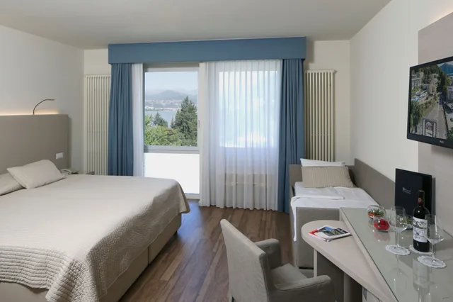 غرفة ثلاثية بسرير كينج وسرير فردي، Hotel Campione 2/4