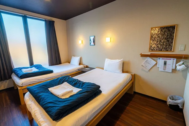 غرفة يابانية ثلاثية بفراش فوتون وسريرين منفصلين بحمام مشترك، Guest House Ouka - Hostel 1/6