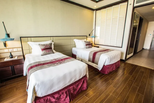 غرفة ديلوكس بسريرين منفصلين بإطلالة على البحر، Vinpearl Resort and Golf Nam Hoi An 1/10