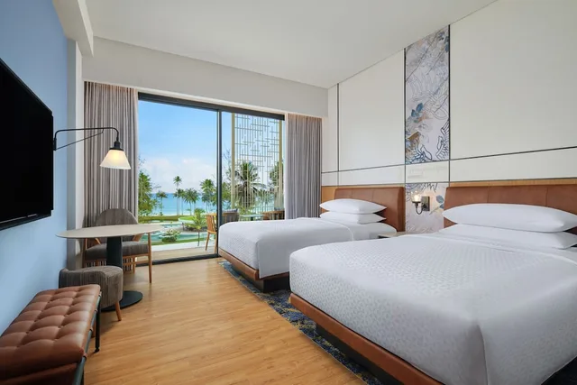 غرفة بسريرين منفصلين بإطلالة على البحر بشرفة، Four Points by Sheraton Bintan, Lagoi Bay 3/4