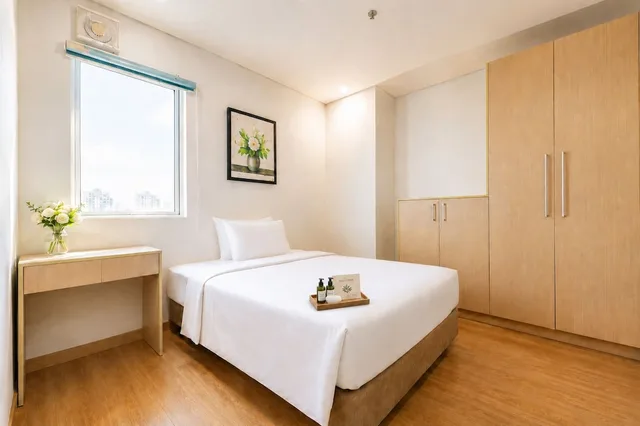 شقة ديلوكس بسرير كوين وسرير مزدوج بإطلالة على المدينة بغرفتي نوم، G8 Center Hotel Saigon 9/10