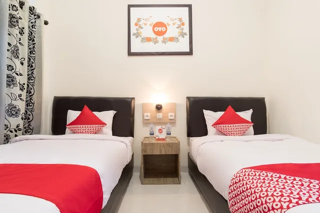 غرفة قياسية بسريرين منفصلين، OYO 873 Kamani Homestay Syariah 1/5