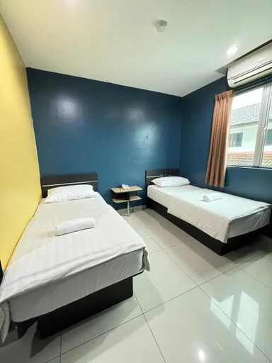 غرفة ديلوكس بسريرين منفصلين، Super OYO Capital O 804 Hotel Pinji 1/3