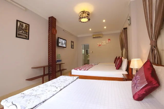 غرفة عائلية بسرير كوين وسرير فردي بإطلالة على الحديقة بشرفة، Green Garden Homestay 1/6