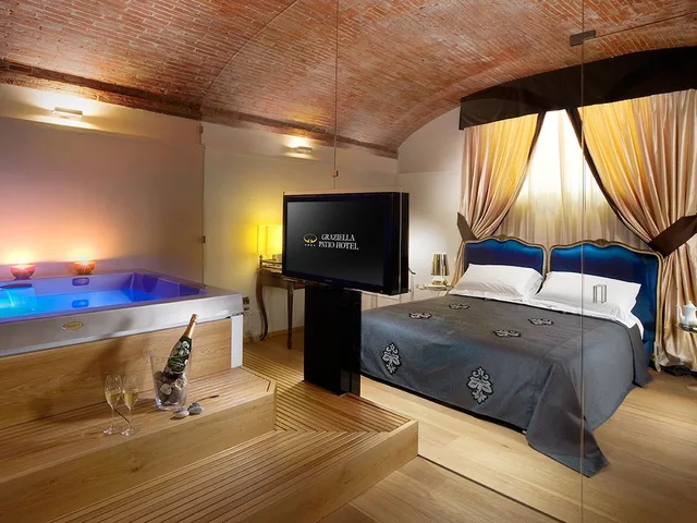 جناح استوديو سوبيريور بسرير كوين بجاكوزي، Graziella Patio Hotel 1/2